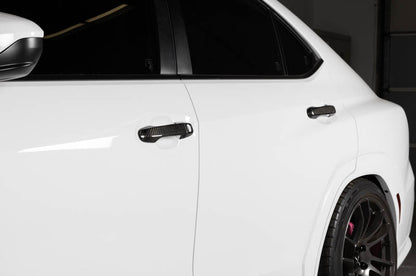 OLM carbon fiber door handle covers for 2022 WRX base and premium trims, exterior trim accessory with a sleek carbon fiber finish.