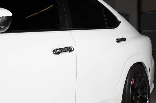 OLM carbon fiber door handle covers for 2022 Subaru WRX GT and Limited trims, exterior trim accessory with a sleek carbon fiber finish.