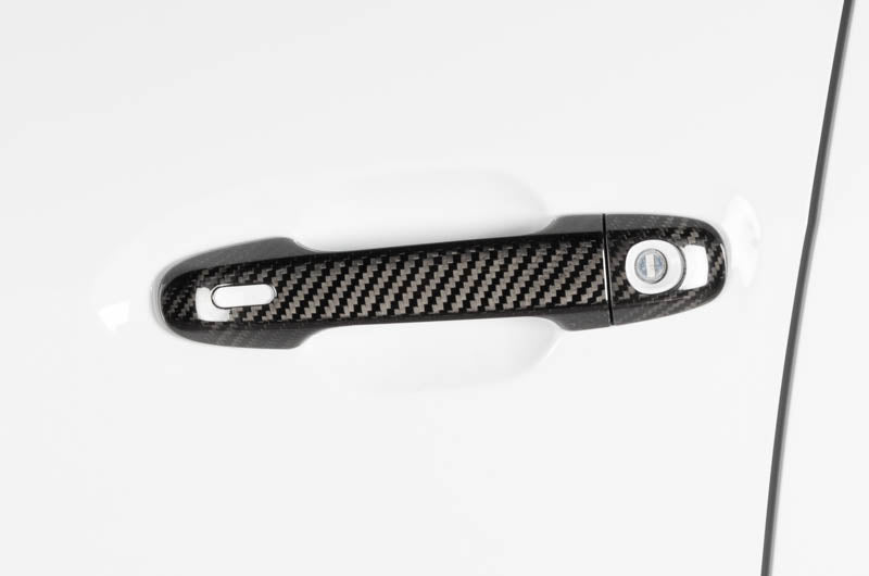 OLM carbon fiber door handle covers for 2022 Subaru WRX GT and Limited trim, exterior trim accessory with a sleek carbon fiber finish.