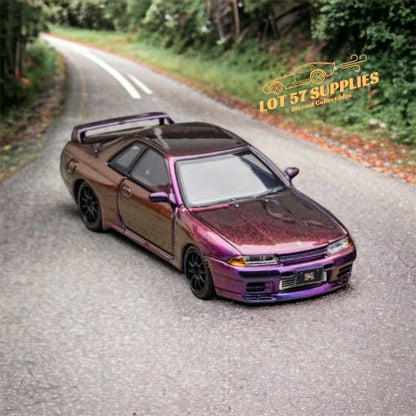 Focal Horizon Nissan Skyline R32 GT-R diecast model in magic purple, 1:64 scale, with detailed exterior features.