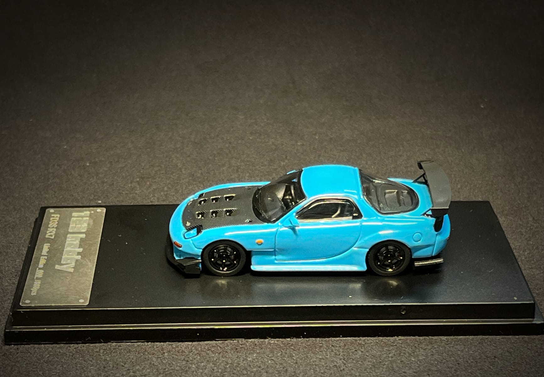 Baby blue Mazda FD3S RX-7 diecast model in 1:64 scale by Lot57Supplies Diecast Shop, detailed miniature car for collectors.