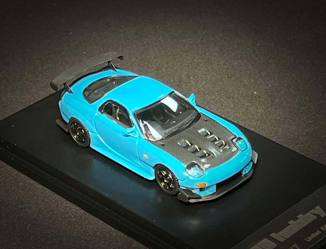 Baby blue Mazda FD3S RX-7 diecast car in 1:64 scale by Lot57Supplies, detailed model showcasing sporty design and authentic features.