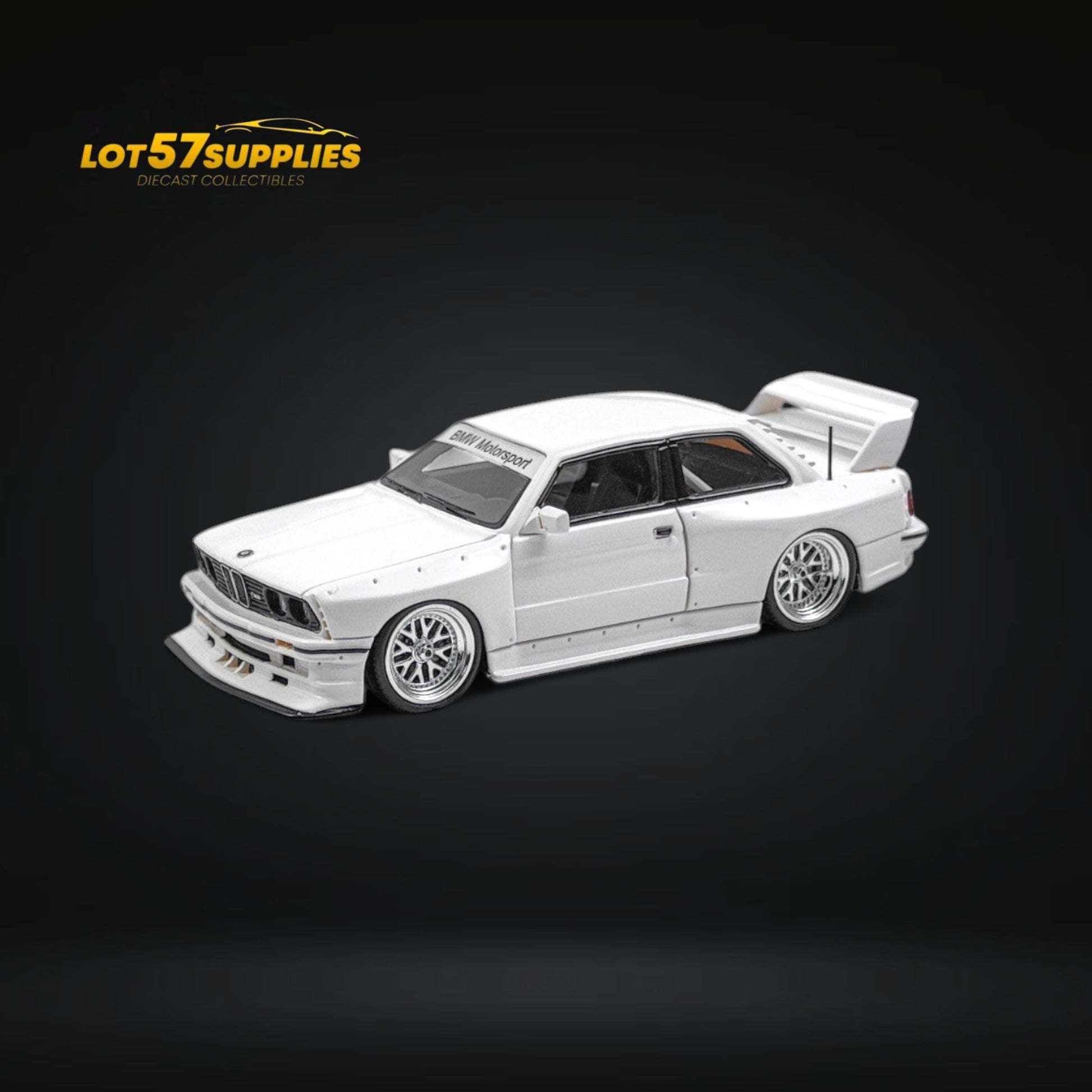 White 1:64 scale BMW E30 wide-body diecast model by Lot57Supplies, detailed miniature collector's car.