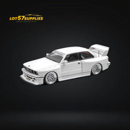 White 1:64 scale BMW E30 wide-body diecast model by Lot57Supplies, detailed miniature collector's car.