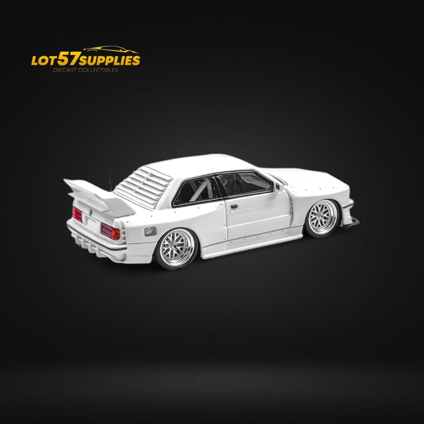 White BMW E30 wide-body diecast model in 1:64 scale by Lot57Supplies Diecast Shop, detailed view of the miniature car.