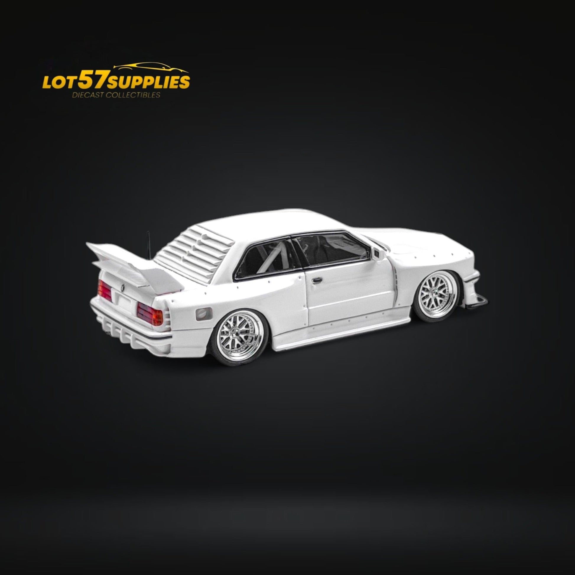 White BMW E30 wide-body diecast model in 1:64 scale by Lot57Supplies Diecast Shop, detailed view of the miniature car.