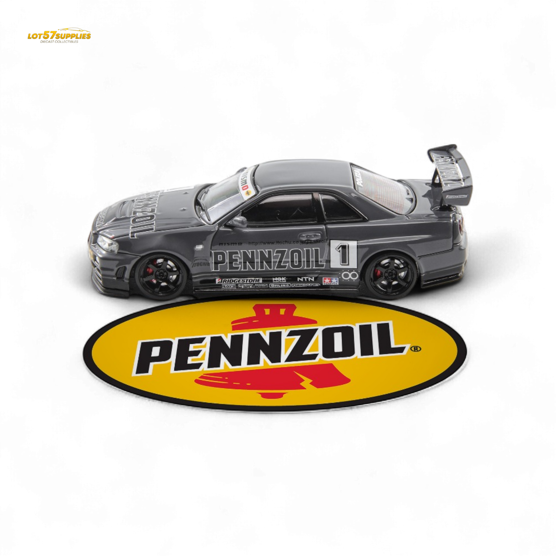 Gray Nissan Skyline GT-R R34 Nismo Z-Tune diecast model in 1:64 scale, featuring detailed exterior design and branding.