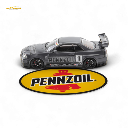 Gray Nissan Skyline GT-R R34 Nismo Z-Tune diecast model in 1:64 scale, featuring detailed exterior design and branding.