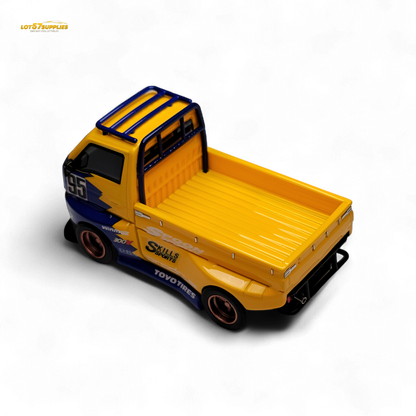 Suzuki Carry D12 Widebody diecast model in 1:64 scale, detailed yellow toy vehicle from Lot57Supplies Diecast Shop.