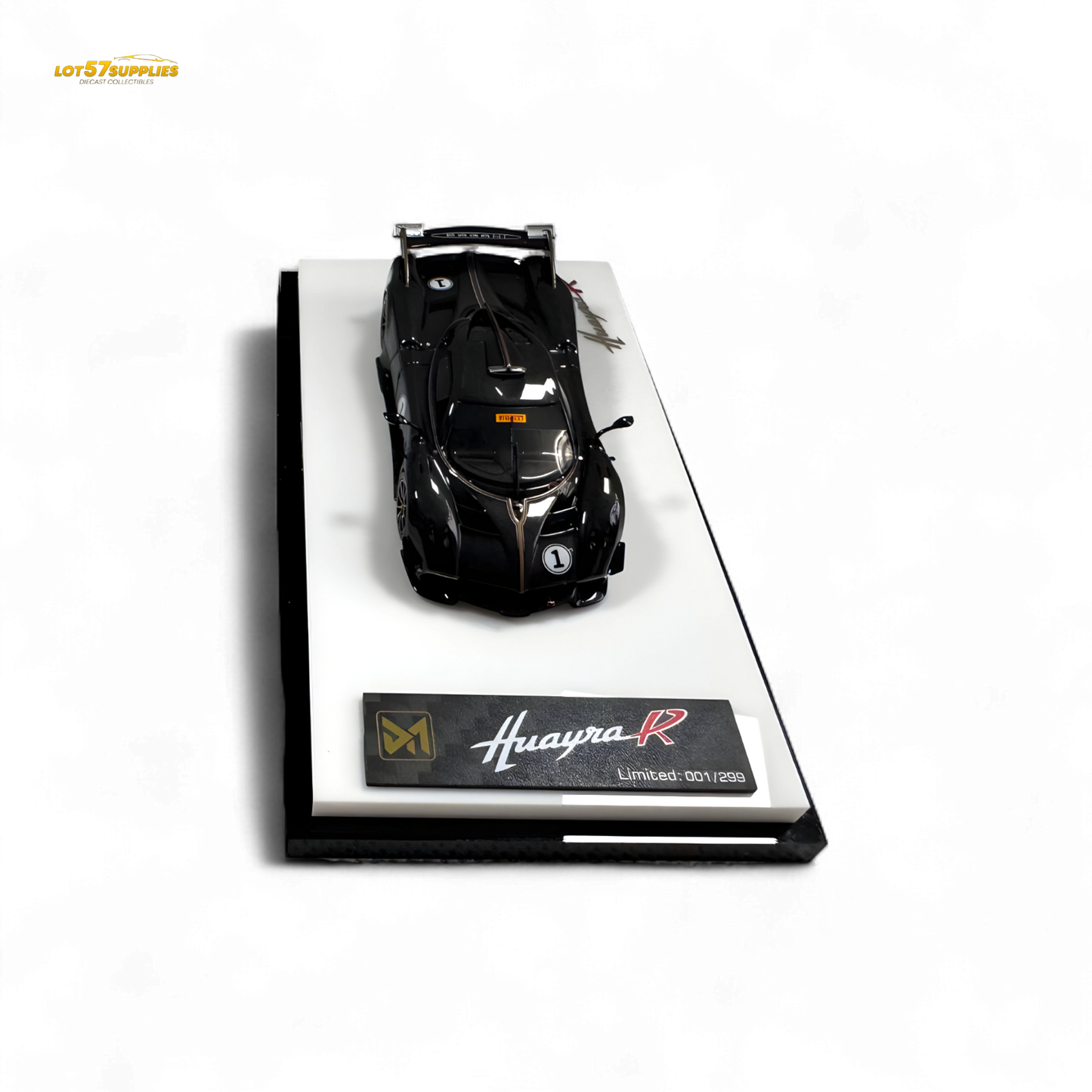 Black carbon DMY Pagani Huayra R diecast model in 1:64 scale, detailed miniature car showcasing sleek design and intricate features.