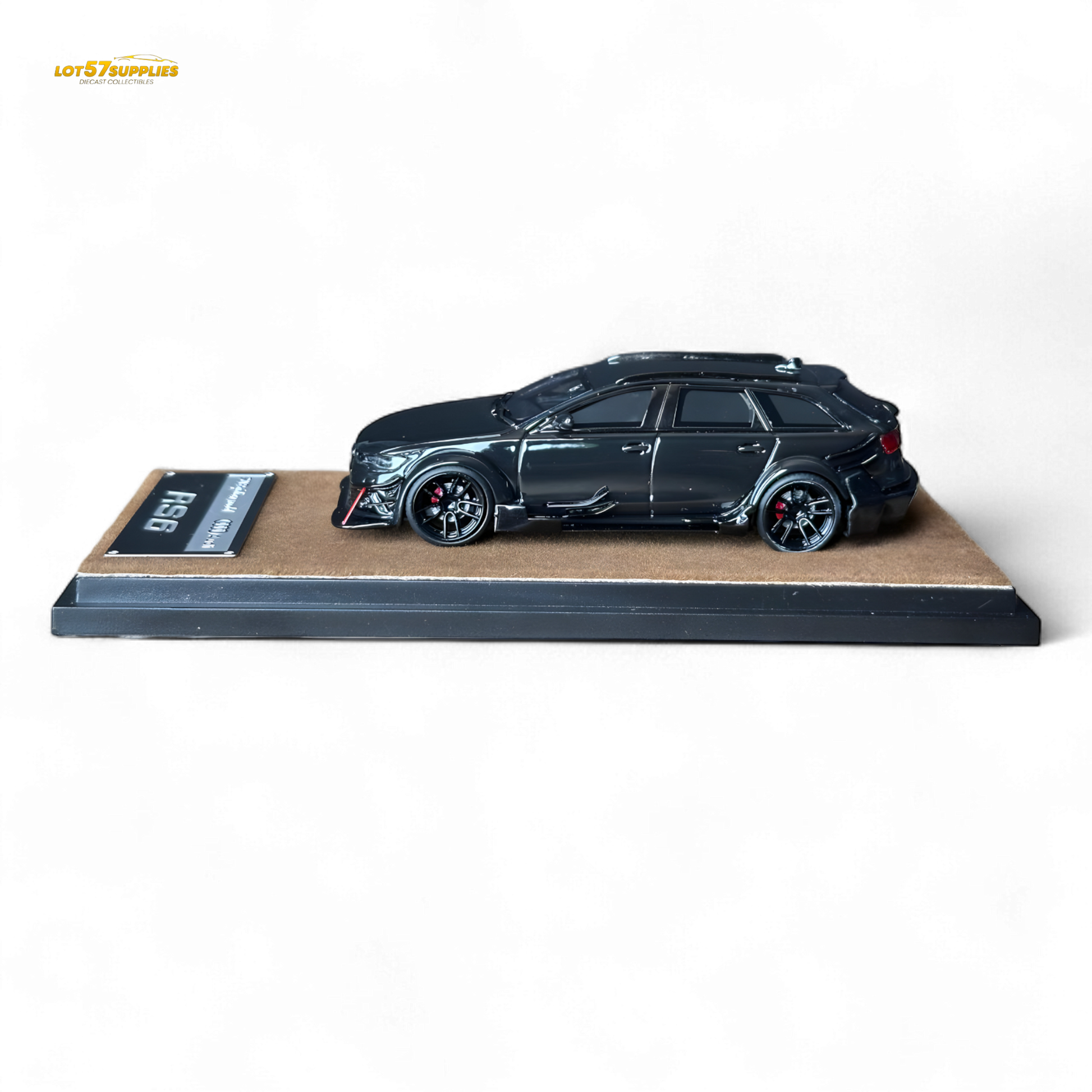 Black Qidian model Audi RS6 Avant (C7) wide-body diecast car in 1:64 scale, detailed miniature with modified design.