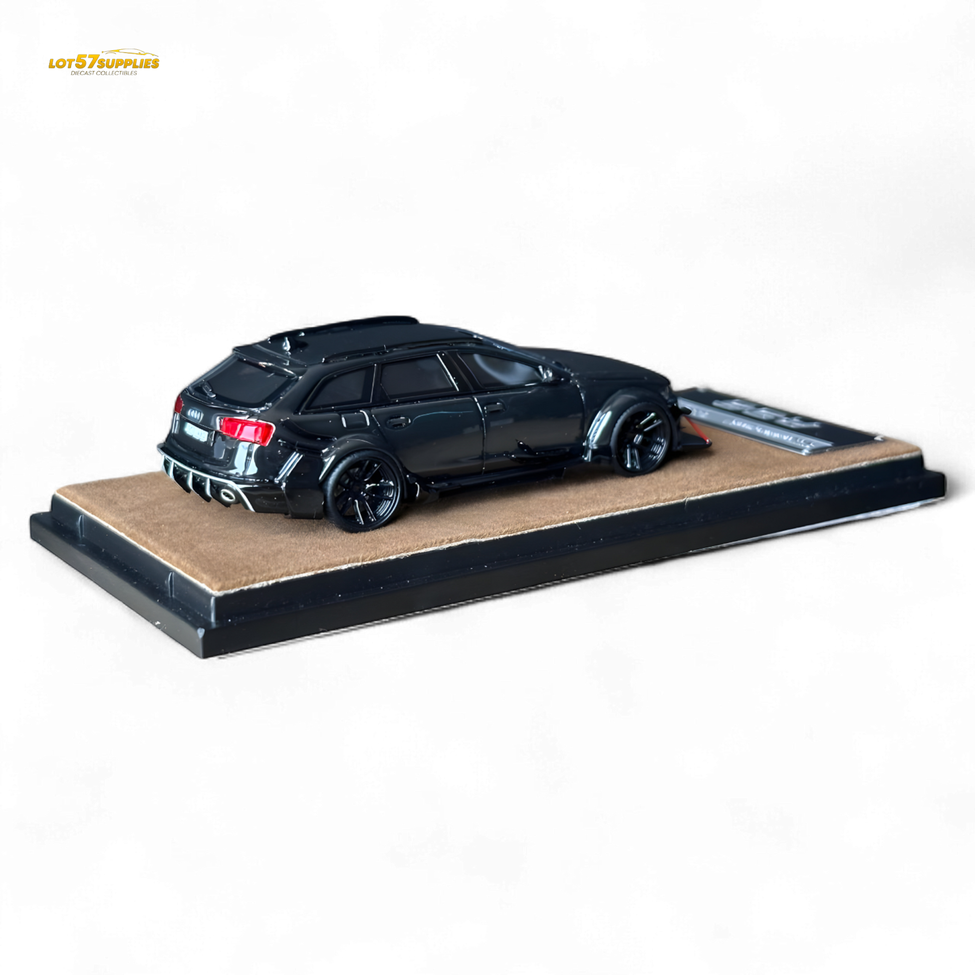 Black Qidian model Audi RS6 Avant (C7) wide-body diecast car, 1:64 scale, featuring detailed modifications and realistic design.