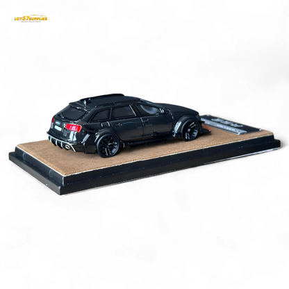 Black Qidian model Audi RS6 Avant (C7) wide-body diecast car, 1:64 scale, featuring detailed modifications and realistic design.