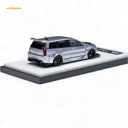 Glossy silver Mitsubishi Lancer EVO 9 Wagon diecast model in 1:64 scale, detailed miniature car by Lot57Supplies Diecast Shop.