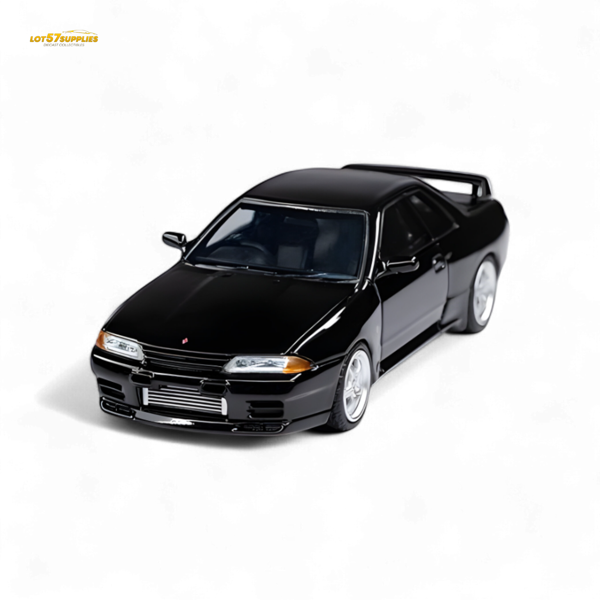 Black Nissan Skyline GT-R R32 Nismo S-Tune diecast model in 1:64 scale, featuring detailed exterior and authentic design.