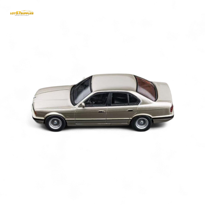 Gold 1:64 scale BMW E34 5-Series sedan diecast model in cashmere beagle color by Lot57Supplies Diecast Shop