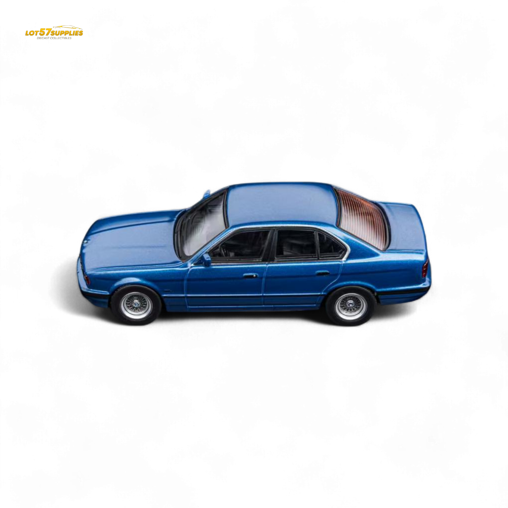 Pre-order DCM BMW E34 5-Series sedan diecast model in Avis Metallic Blue, 1:64 scale, by Lot57Supplies Diecast Shop.