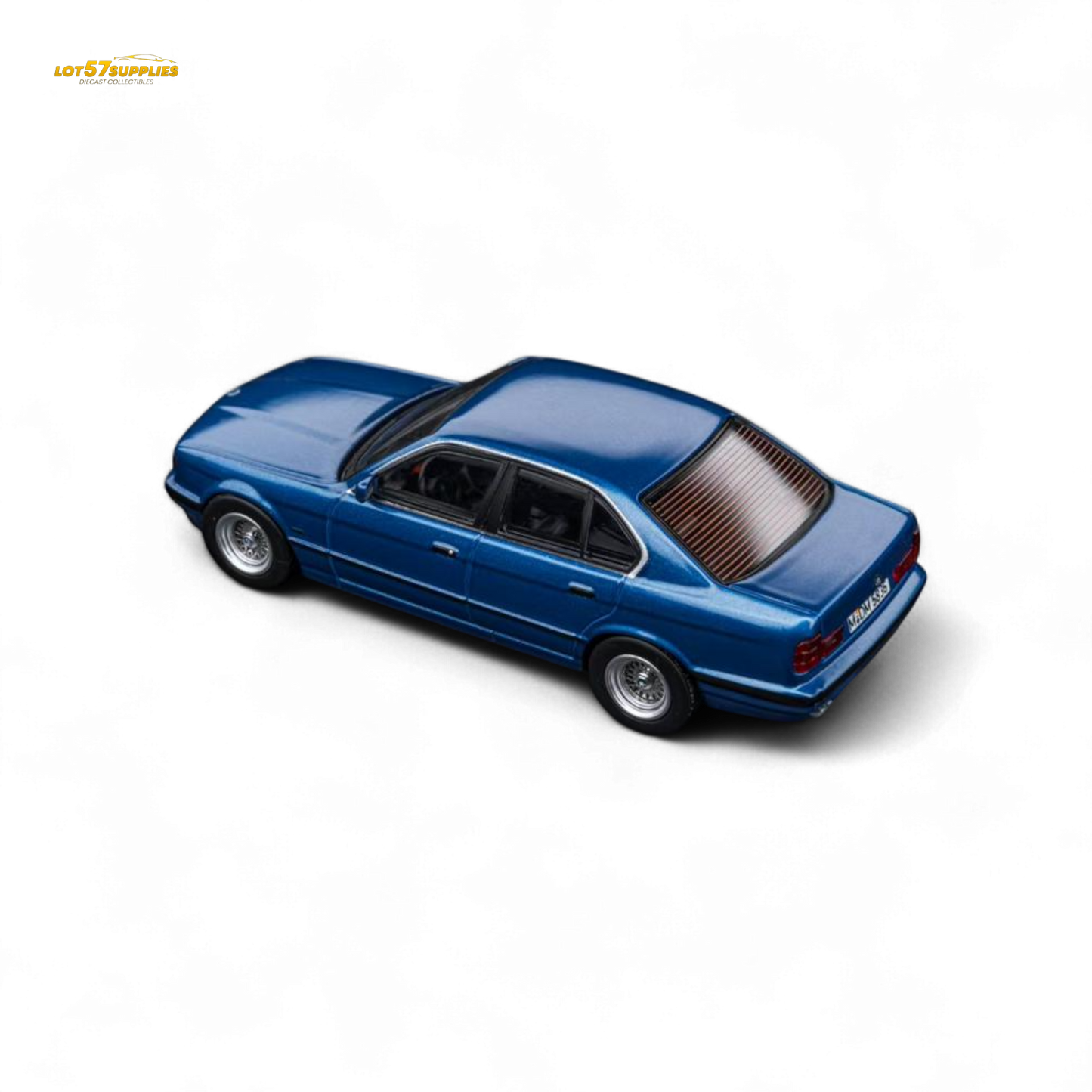 Pre-order model of Lot57Supplies BMW E34 5-Series Sedan in Avis Metallic Blue, 1:64 scale diecast car image.