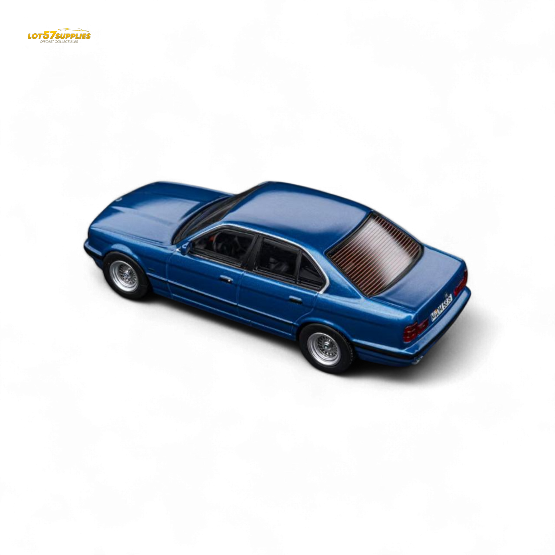 Pre-order model of Lot57Supplies BMW E34 5-Series Sedan in Avis Metallic Blue, 1:64 scale diecast car image.
