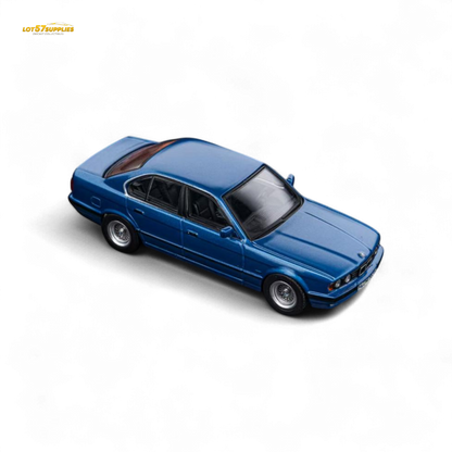 Pre-order diecast BMW E34 5-Series sedan in Avis Metallic Blue, 1:64 scale by Lot57Supplies Diecast Shop.