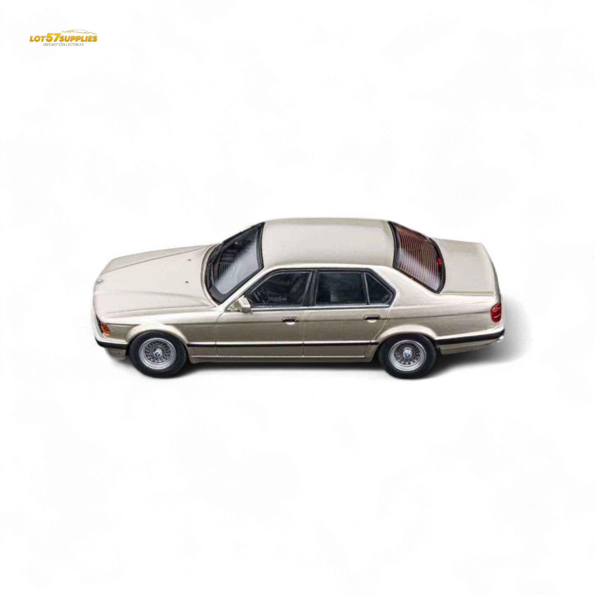 Gold beagle diecast model of BMW E32 7-Series sedan in 1:64 scale by Lot57Supplies, featuring detailed craftsmanship.
