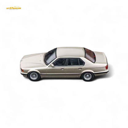 Gold beagle diecast model of BMW E32 7-Series sedan in 1:64 scale by Lot57Supplies, featuring detailed craftsmanship.