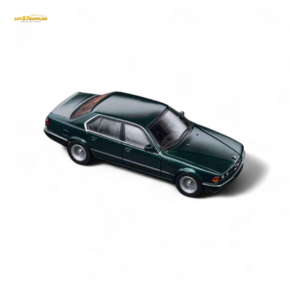 Detail of a green diecast BMW E32 7-Series sedan in Oxford Metallic green, 1:64 scale model by Lot57Supplies Diecast Shop.