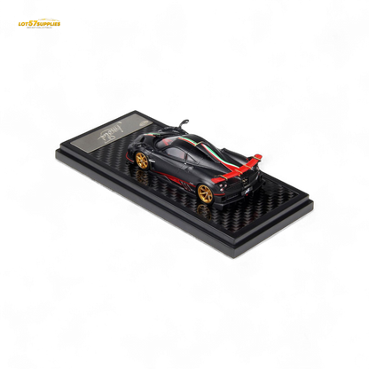 Matte black carbon LCD Pagani Imola diecast model in 1:64 scale, detailed replica showcasing intricate design features.