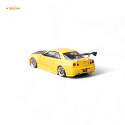 Yellow Nissan Skyline GT-R R34 Z-Tune diecast model with carbon hood, detailed replica from Lot57Supplies Diecast Shop.