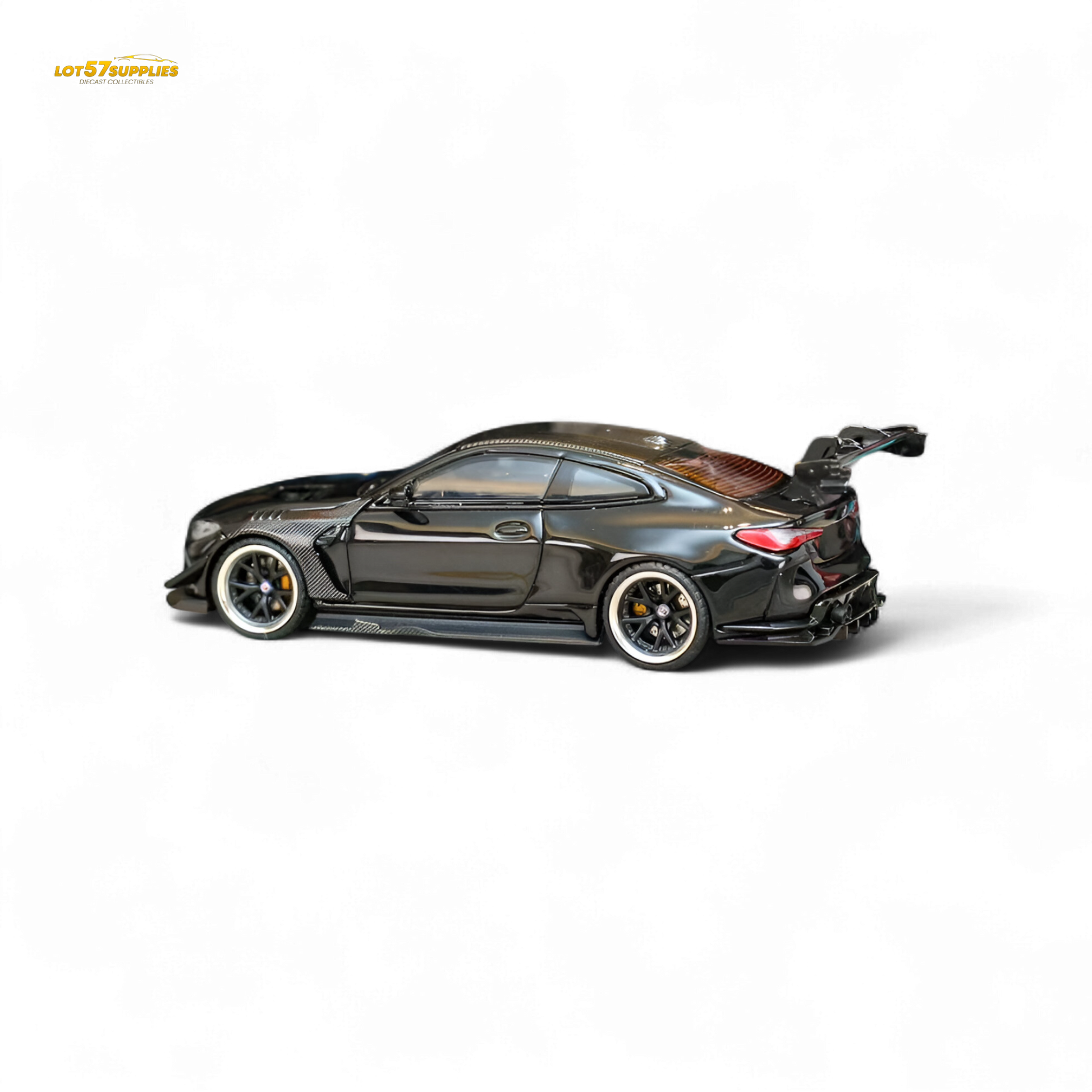 Miniature BMW M4 G82 diecast model with widebody kit in bright black, detailed 1:64 scale replica from Lot57Supplies Diecast Shop