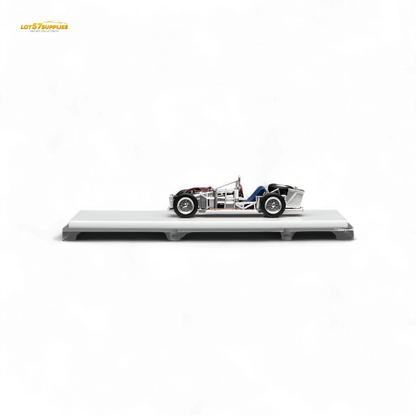 Detail of a 1:64 scale Motorhelix Spaceframe Birdcage diecast model with engine, showcasing intricate design and craftsmanship.