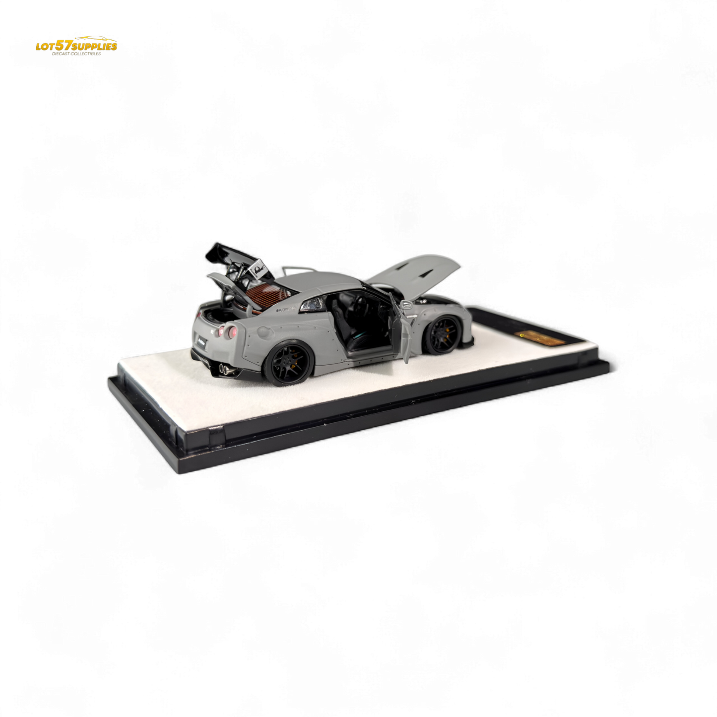 Diecast Nissan PGM Rocket Bunny R35 in combat grey, 1:64 scale, featuring detailed design and aerodynamic body.