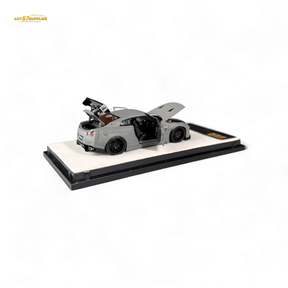 Diecast Nissan PGM Rocket Bunny R35 in combat grey, 1:64 scale, featuring detailed design and aerodynamic body.