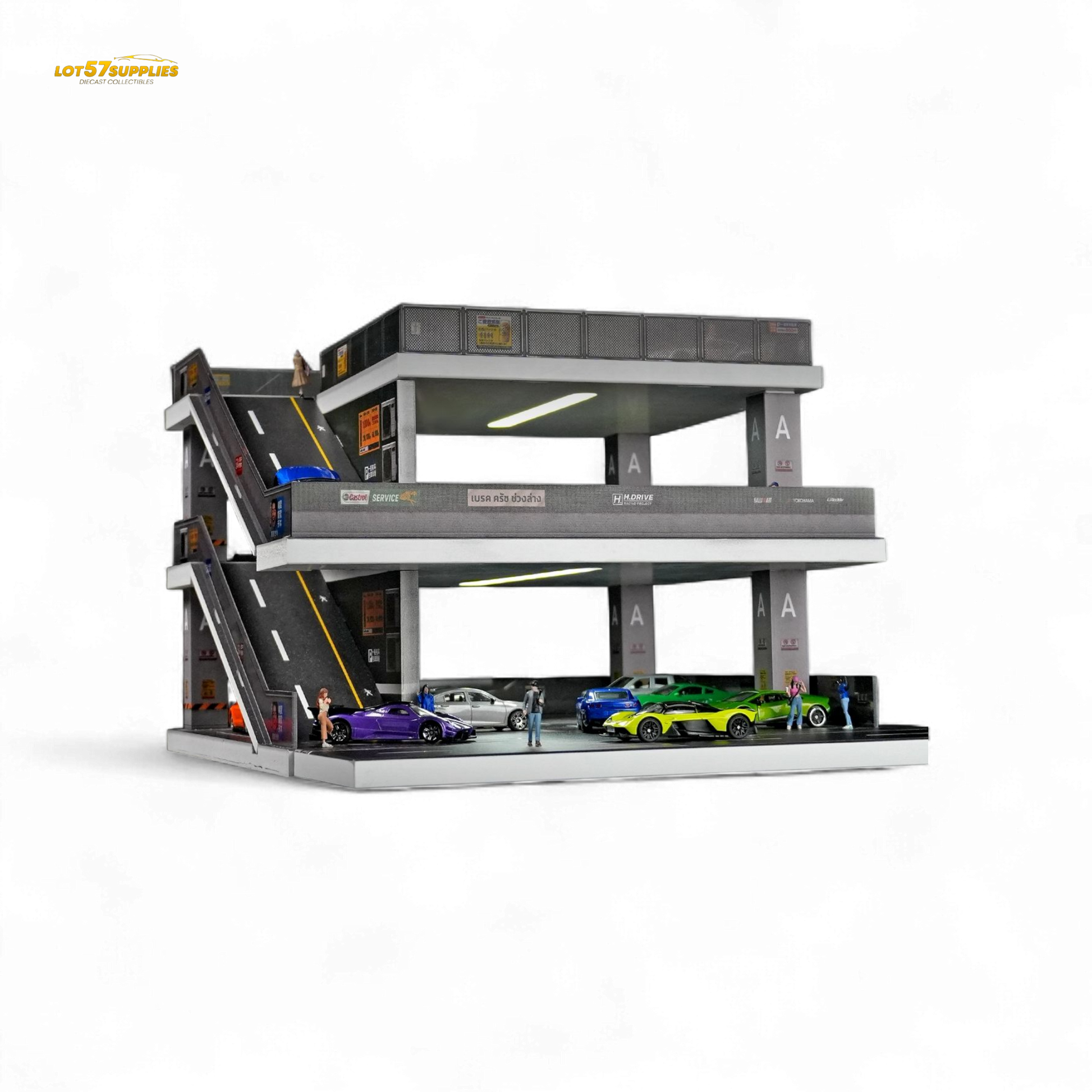 Detailed diorama of a Japanese ramp parking lot in 1:64 scale, featuring realistic miniature cars and parking structures.