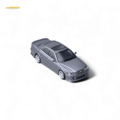 Detailed image of a gunmetal gray Model One Toyota JZX100 diecast car, showcasing realistic features and compact size.