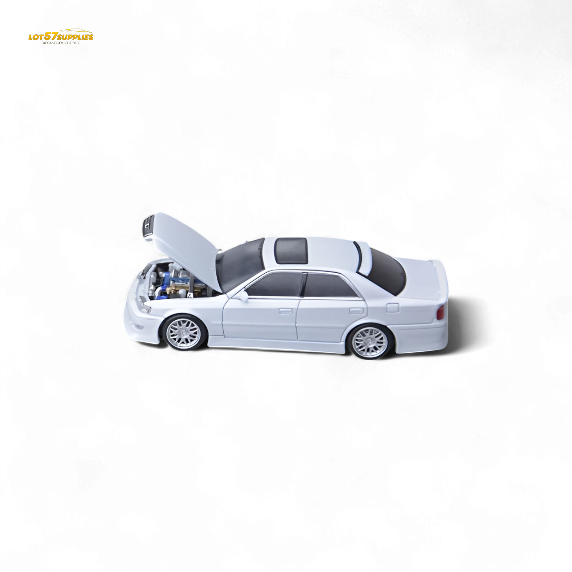 Pearl white Toyota JZX100 diecast model car in 1:64 scale by Lot57Supplies Diecast Shop, detailed miniature vehicle.