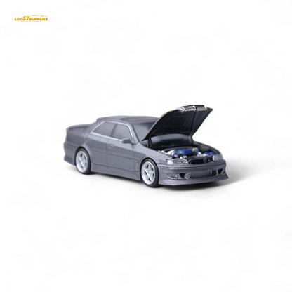 Gunmetal gray Toyota JZX100 diecast model car in 1:64 scale by Lot57Supplies Diecast Shop, detailed view of the miniature vehicle.