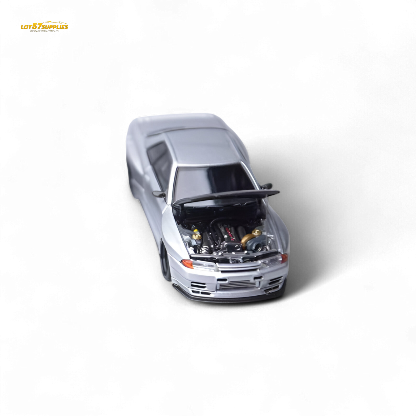Silver Nissan Skyline GT-R R32 diecast model from Focal Horizon Skyline series, detailed 1:64 scale collectible.