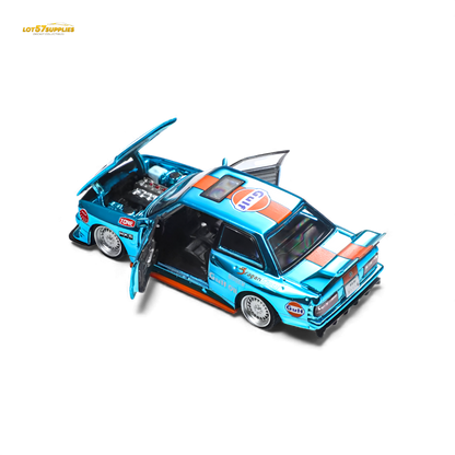 Demon King Auto BMW E30 Gulf diecast model car in 1:64 scale, detailed black and Gulf livery, collectible toy vehicle.