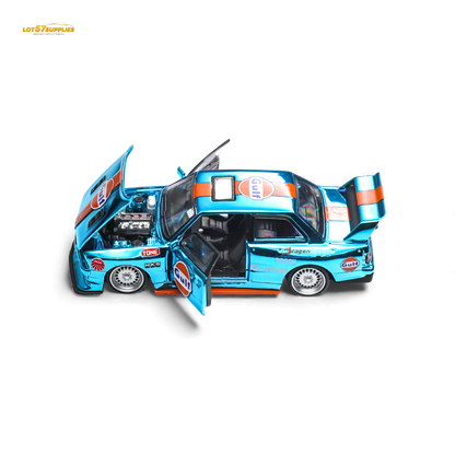 Diecast BMW E30 Demon King Auto model in Gulf racing livery, 1:64 scale from Lot57Supplies Diecast Shop, detailed miniature car.