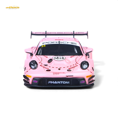 Pink Pig livery Porsche 911 GT3 R diecast model in 1:64 scale, featuring detailed racing design and vibrant pink accents.