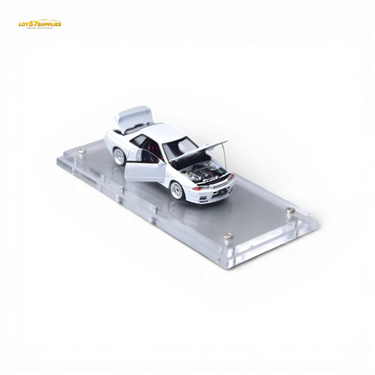 White Nissan Skyline GT-R R32 Nismo S-Tune diecast model by Lot57Supplies, detailed 1:64 scale car, showcasing sleek design and racing features.