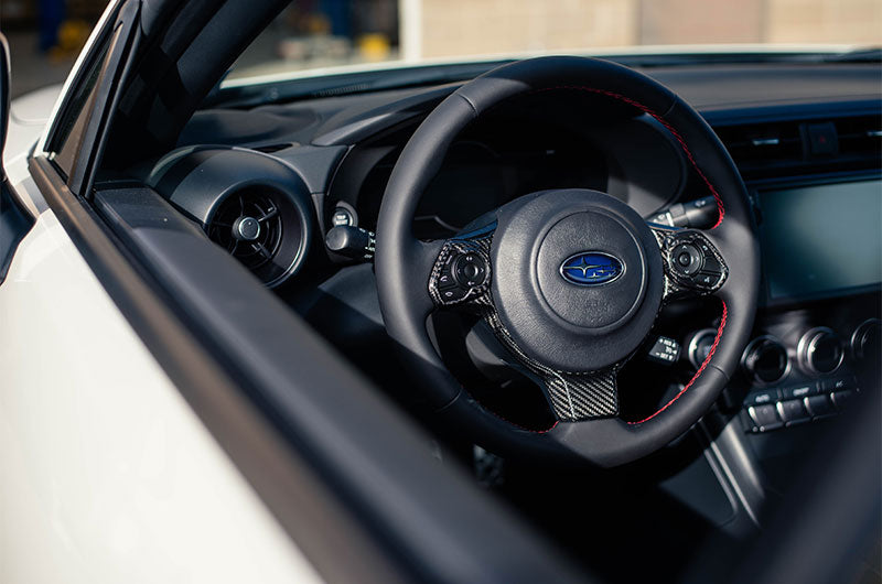 OLM LE dry carbon fiber steering wheel trim for Subaru BRZ and Toyota GR86