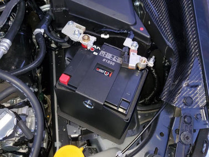MeLe ATX30 Rally Spec battery mount showing durable metal construction and secure mounting features for RC vehicles.