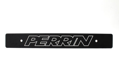 JDMuscle black license plate delete for Subaru WRX, STI, and BRZ, reversible design, shown on vehicle front bumper.