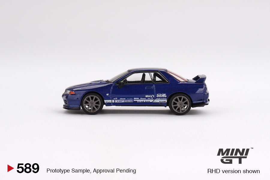 Mini-GT Nissan Skyline GT-R R32 diecast model in metallic blue, 1:64 scale, detailed Nissan collectible from Lot57Supplies Diecast Shop.