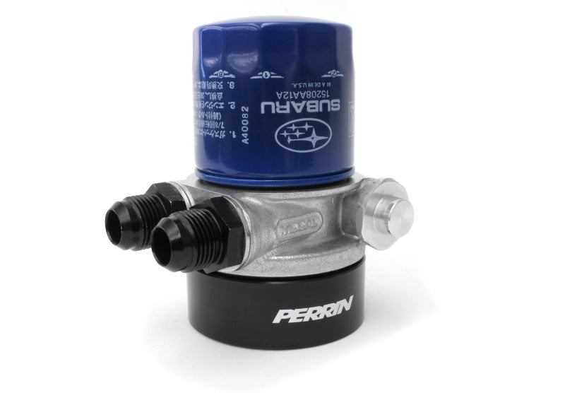 JDMuscle Perrin 02-14 WRX and 04-21 STI oil cooler kit with fluid cooler and hoses installed on a vehicle engine.
