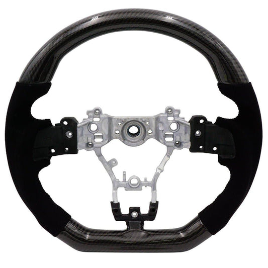 BLOX Racing carbon and Alcantara steering wheel with black stitching for 2015-2021 Subaru WRX and STI interior.