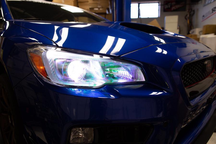 Chameleon headlight overlays on 2015-2020 Subaru WRX/STI headlights by StickerFab, showcasing vibrant, color-shifting accents.