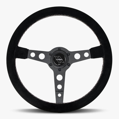 Black Alcantara suede steering wheel with black spoke and white stitching by Speedzone Performance LLC.